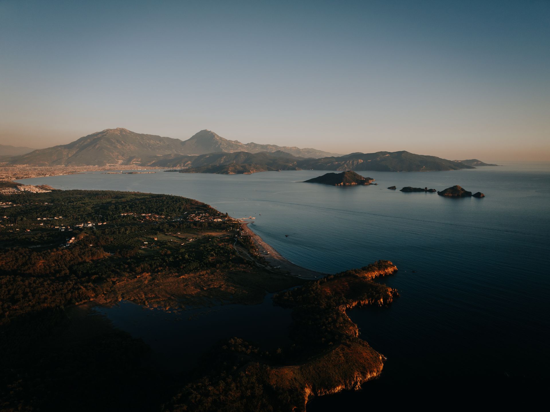 Coastal road at sunrise seen from above
